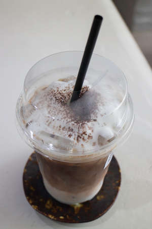 A glass of iced coffee latte with art, stock photo