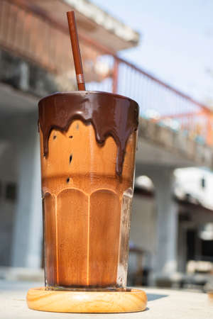 Glass of ice cubes and fresh coffee, stock photo