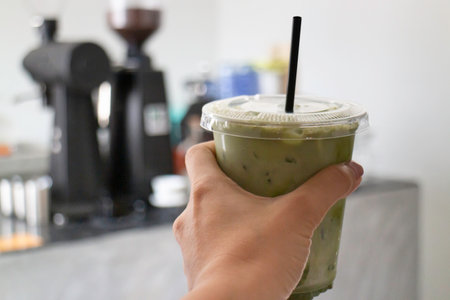 Melted iced green tea latte , stock photo