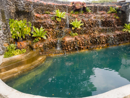 Beautiful landscaping with small pond and waterfall, stock photoの写真素材