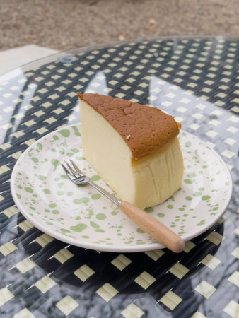 Piece of cheesecake serving in the garden, stock photoの写真素材