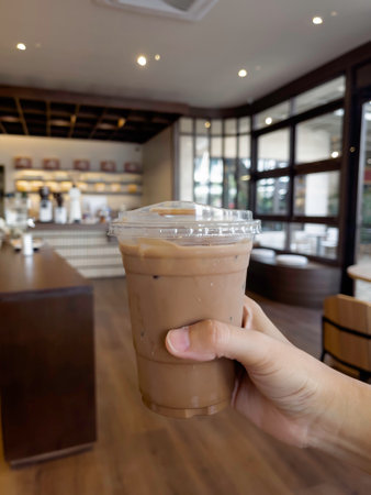 Hand on iced milk coffee, stock photoの写真素材