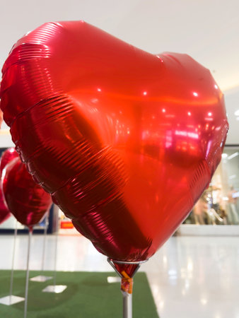 Set of red color heart shaped foil balloons, stock photoの写真素材