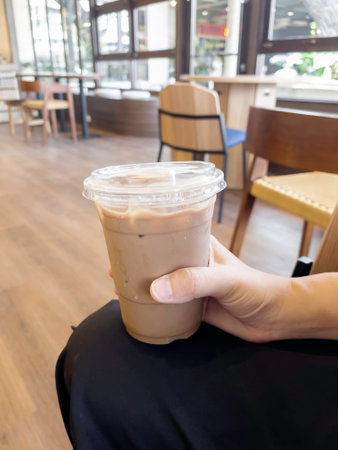 Hand on iced milk coffee, stock photoの写真素材