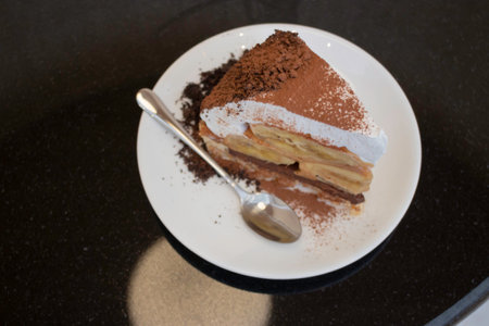 Banoffee cake with bananas and whipped cream in cafe restaurant, stock photoの写真素材