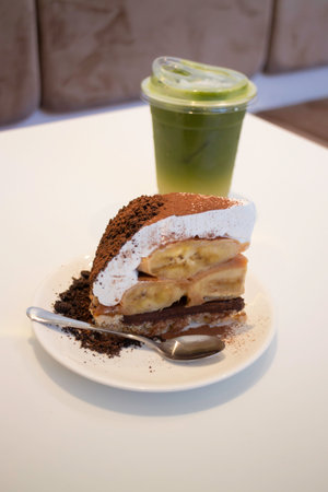 Banoffee cake with bananas and whipped cream in cafe restaurant, stock photoの写真素材