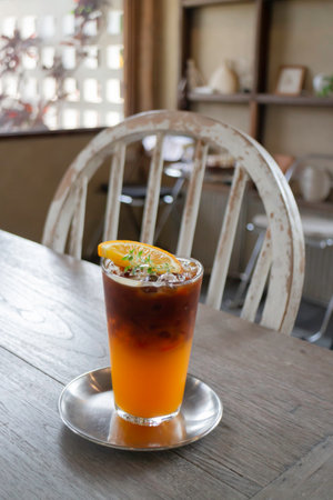 Iced americano black coffee mix of orange juice, stock photoの写真素材