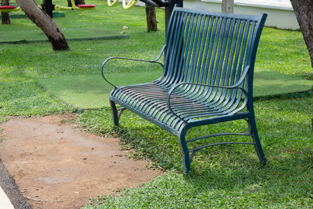 Old bench in the park sidewalk, stock photoの写真素材
