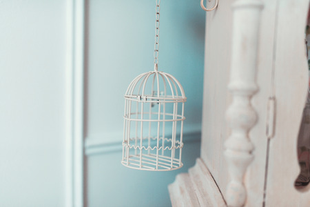 White birdcage in the interior bright roomsの写真素材