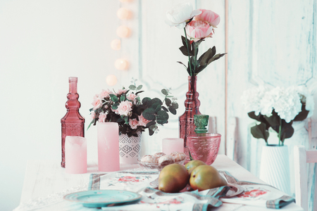 Beautifully decorated table adorned with flowers and pearsの写真素材