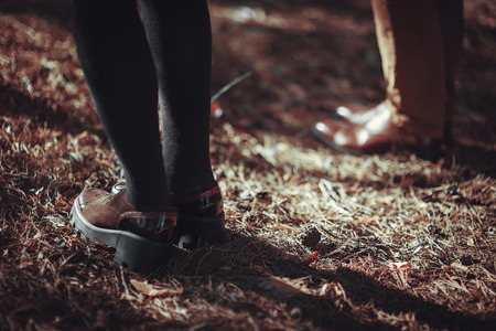 Couple Man and Woman Feet in Romantic Outdoor Lifestyle with nature on background Fashion trendy styleの写真素材