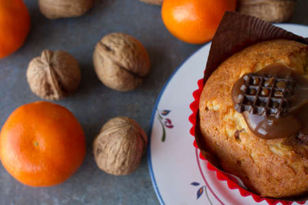 chocolate and vanilla Lemon muffins with tangerines and walnutsの写真素材