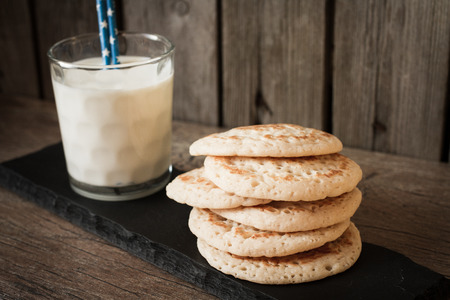 pancakes with milk on a gray background