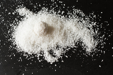 coconut and Raffaello on a black backgroundの写真素材