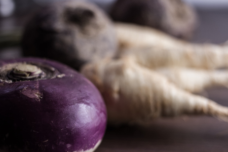root vegetables from the garden on a brown backgroundの写真素材