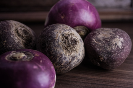 root vegetables from the garden on a brown backgroundの写真素材