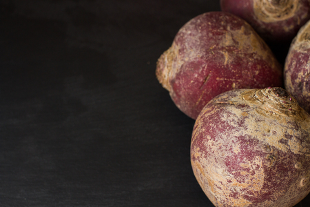 root vegetables from the garden on a black backgroundの写真素材