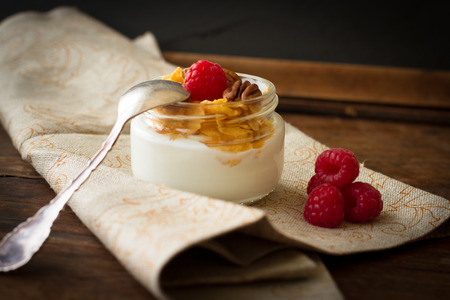 yogurt for breakfast with nuts raspberry and milk. Diet for Womenの写真素材