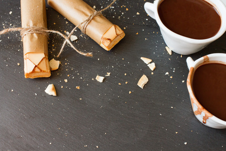 good morning with a cup of cocoa on a wooden backgroundの写真素材