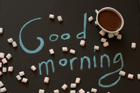 good morning with a cup of cocoa on a wooden backgroundの写真素材