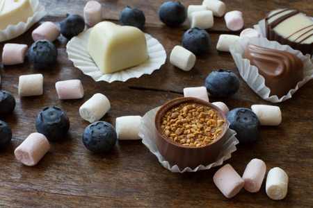 Belgian chocolate and marshmallow on a wooden table