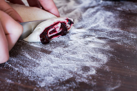 buns from yeast dough with jam prepared at homeの写真素材