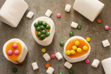white marshmallow and caramel colored candies