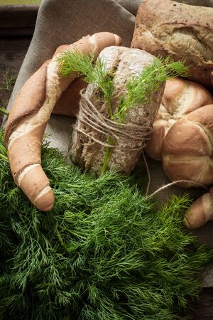 French buns variety of wheat breads with green dillの写真素材