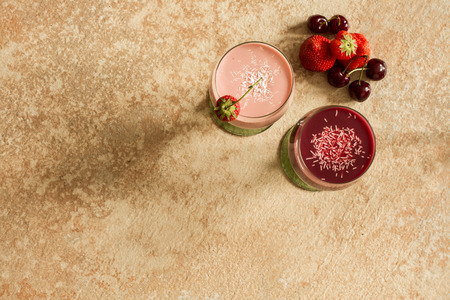 smoothies with strawberries and blueberries in glassesの写真素材