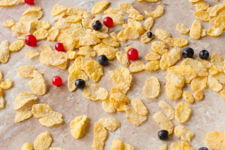 corn flakes with red currants and blueberries for breakfast
