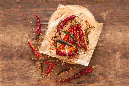 dry  chili pepper on a wooden background
