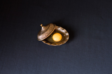 egg yolk in authentic plateの写真素材