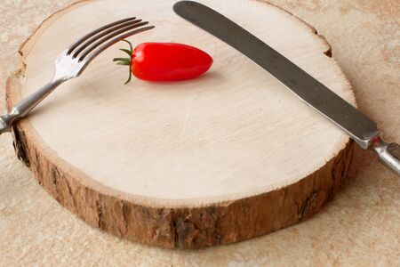 ripe cherry tomatoes on a yellow background stoneの写真素材