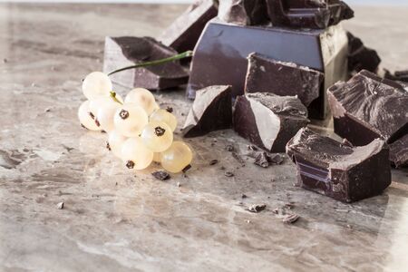 Tiles of dark chocolate on a marble backgroundの写真素材