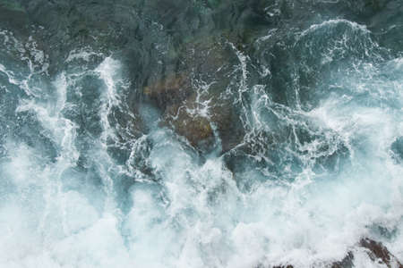 beating the rock sea wave. extreme sportsの写真素材