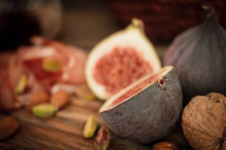 snacks for wine grapes in the form of dates and bacon,の写真素材