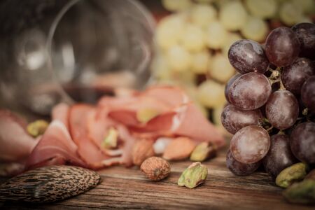 snacks for wine grapes in the form of dates and bacon,の写真素材