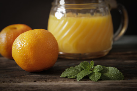 orange juice with mint leavesの写真素材