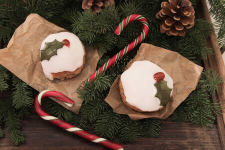 Christmas cake with homemade caramel cane on the background of treesの写真素材