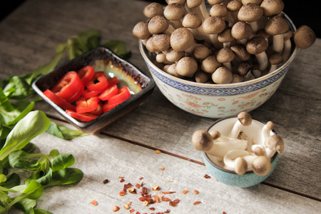 shimeji mushrooms with peppers and lettuce.の写真素材