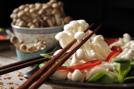 shimeji mushrooms with peppers and lettuceの写真素材