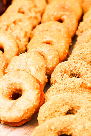 market in the city on the street with sweet donutsの写真素材