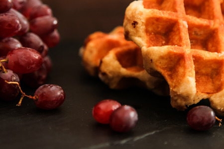 Belgian waffles with blueberries and grapes Breakfastの写真素材