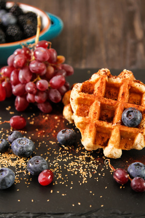Belgian waffles with blueberries and grapes Breakfastの写真素材
