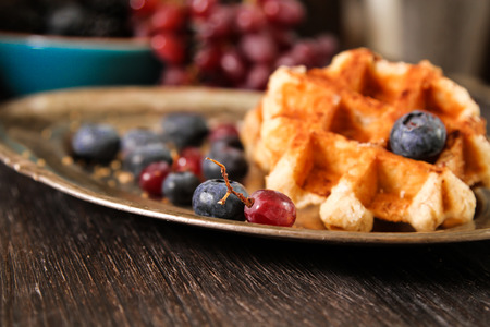 Belgian waffles with blueberries and grapes Breakfastの写真素材