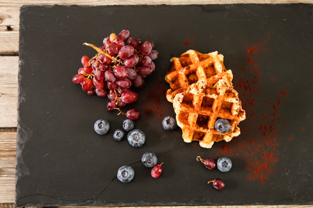 Belgian waffles with blueberries and grapes Breakfastの写真素材