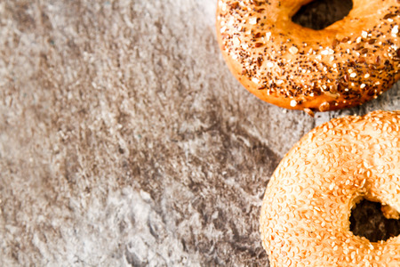 Fresh bagel on a stone background food for breakfastの写真素材