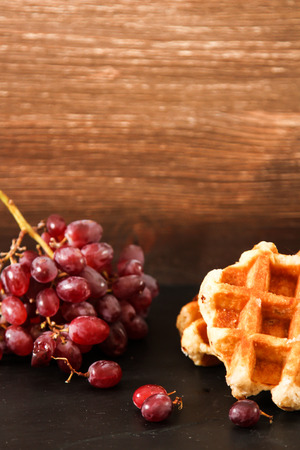 Belgian waffles with blueberries and grapes Breakfastの写真素材