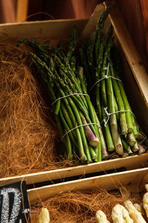 Fresh wild asparagus on the wooden table, selective focusの写真素材