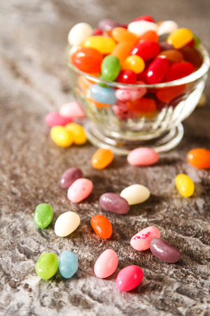 Colorful Jelly Beans (close-up shot) on background stoneの写真素材